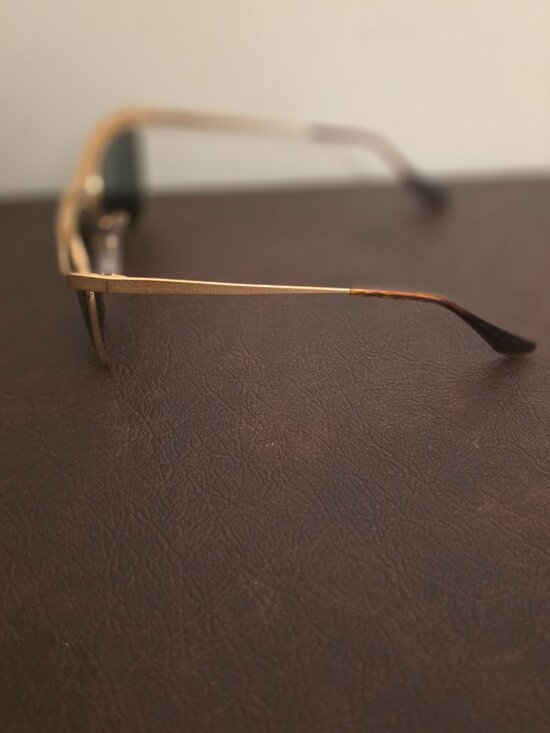 The Vintage Ray-Ban Sunglasses feature a classic gold metal frame with Olympian main image 4